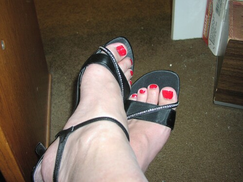 Red toes in black heels