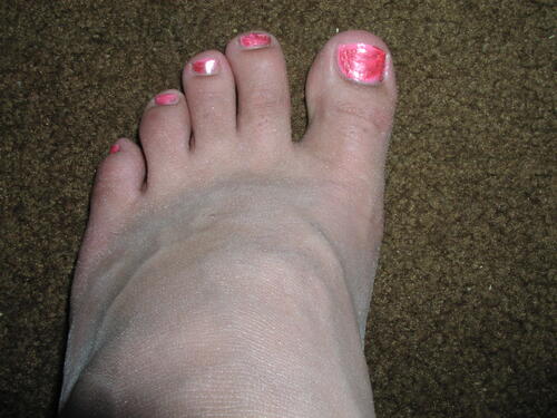 Pink polished nails