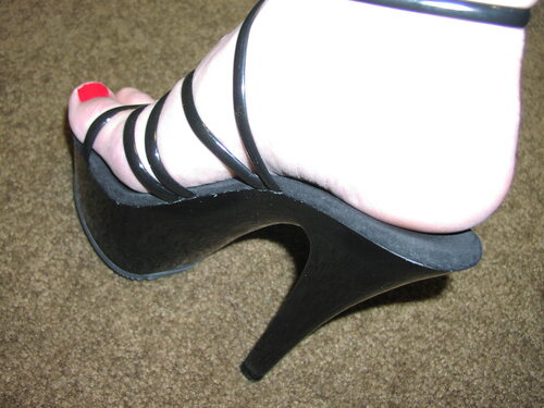 Shiny heels love to crush and destroy