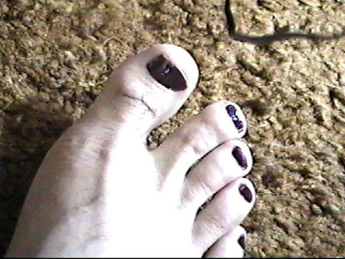 Tasty toenails painted black